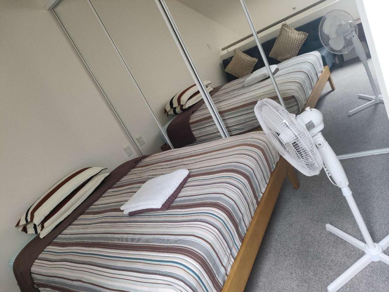 3 Double Beds And 1 Single Bed And 2 Double Sofa Beds In A Small 2 Bedrooms Penthouse Apartment Auckland